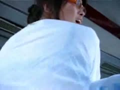 Sian gal becomes enraged in the rear of the bus.